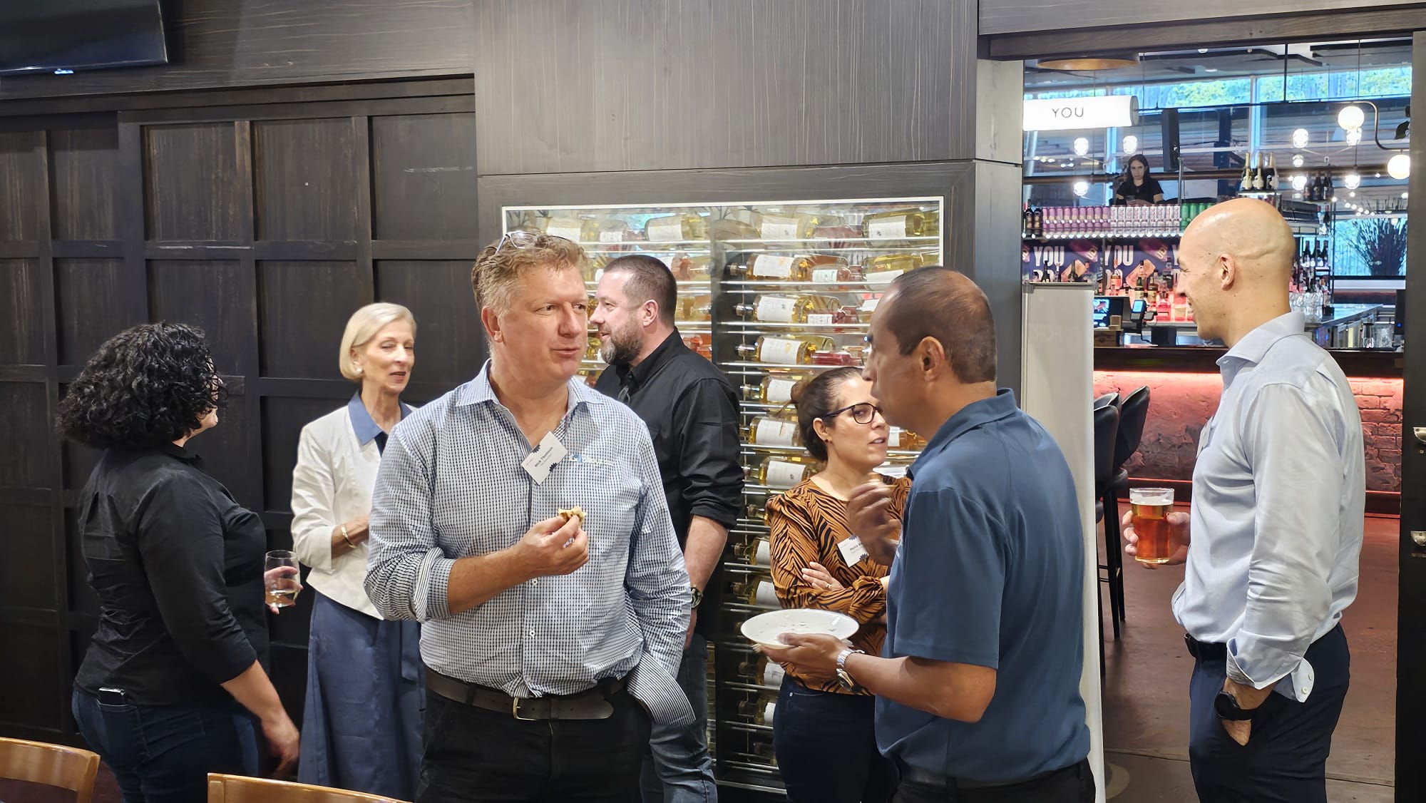 Toolbox attendees networking in small groups