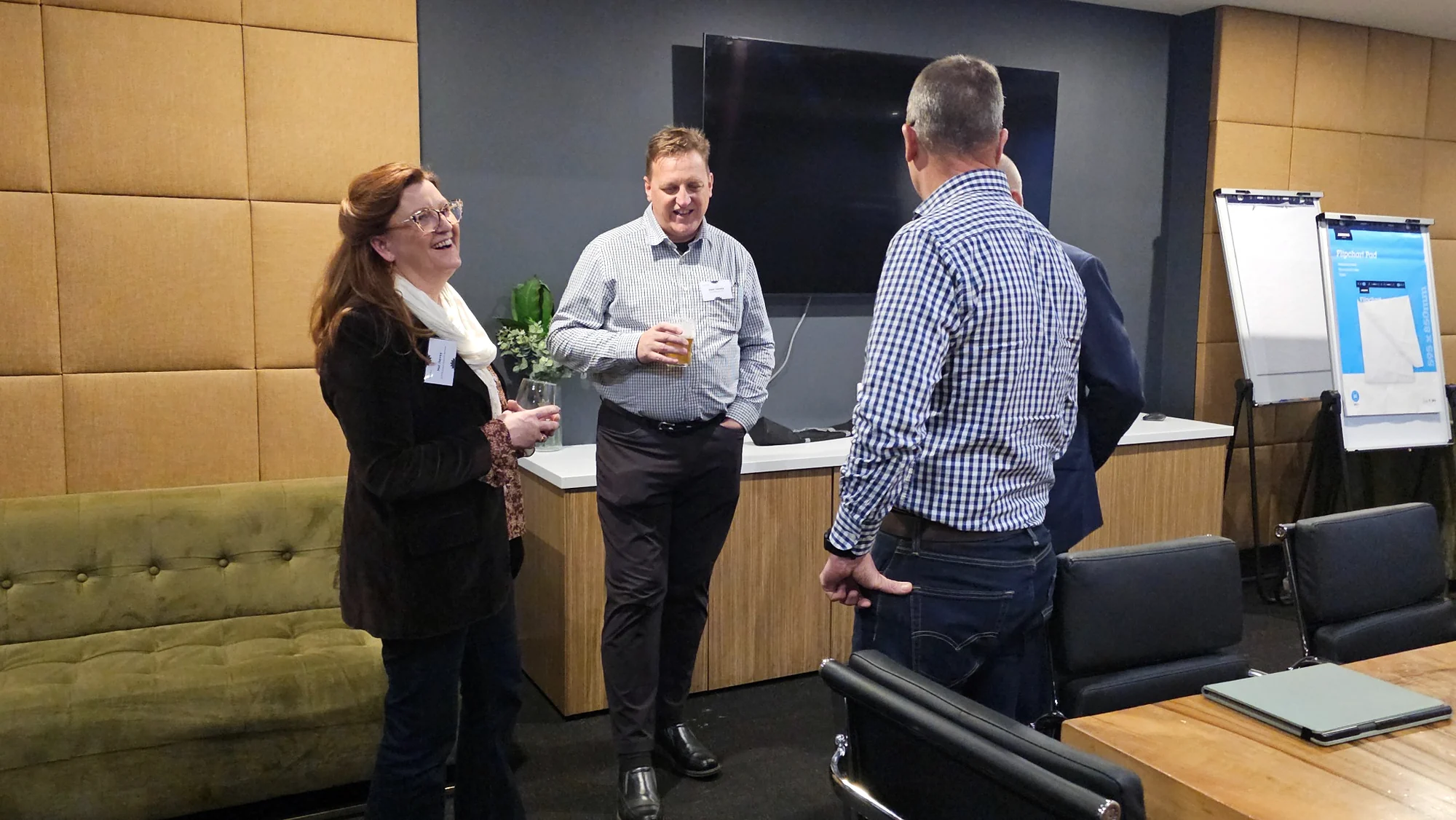 Attendees sharing a laugh at a Toolbox networking evening